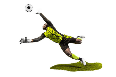 男足球运动员守门员在跳跃中接球。 适合男子的剪影与球隔离在白色工作室背景上