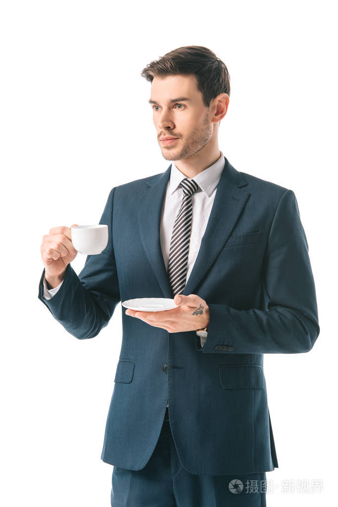 公司商人西装革履,把咖啡杯隔在白色上