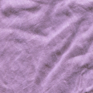 亚麻紫色织物的纹理。紫色面料背景
