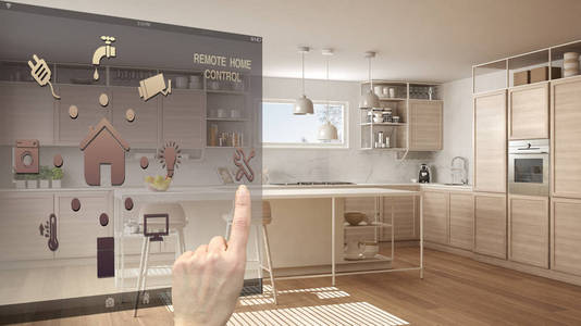 智能家居控制概念手控制数字接口从移动应用程序。 模糊背景显示现代白色木制现代厨房建筑室内设计