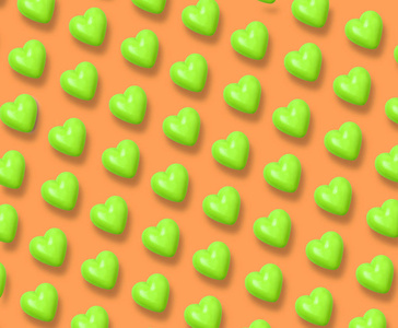橙色背景上的绿色心脏图案