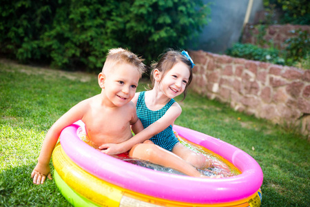 s summer vacation. Two Caucasian children, brother and sister, s