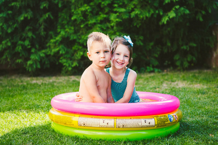 s summer vacation. Two Caucasian children, brother and sister, s