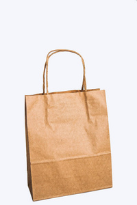 牛皮纸袋在白色背景下连续出售购物和礼物