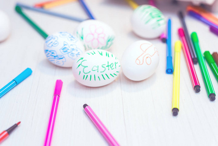 s drawings are on the table with markers. Easter ideas. Space fo