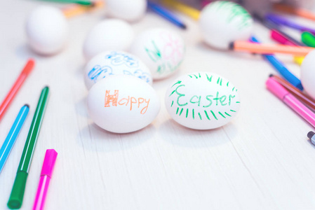 s drawings are on the table with markers. Easter ideas. Space fo