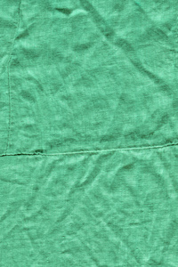 绿松石织物背景纹理。 来自纺织材料的绿松石背景