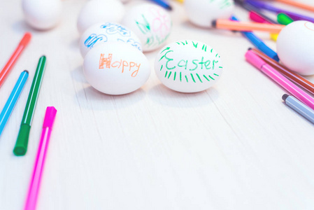 s drawings are on the table with markers. Easter ideas. Space fo