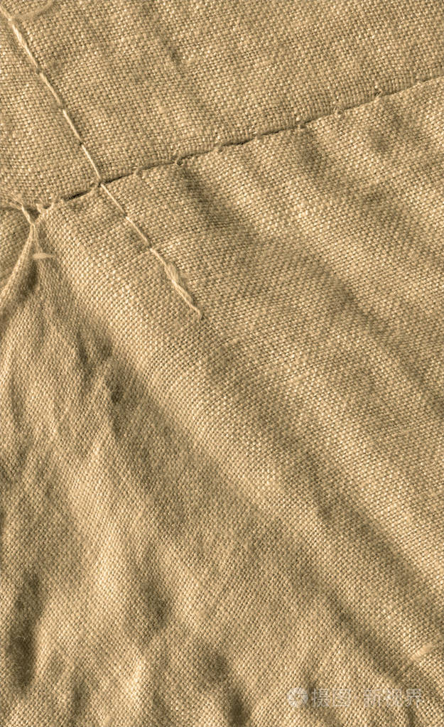 浅棕色的布料. 轻盈的天然亚麻纹理. 棕色帆布背景纹理