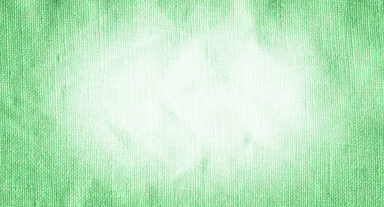 绿色织物表面为背景。 特写绿色织物表面。 天然绿色亚麻纹理