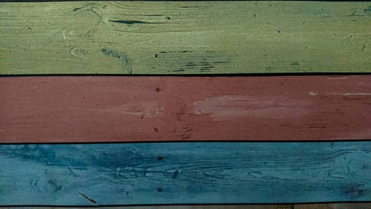 古老的木制彩色木板纹理背景。 旧木板涂上了许多颜色。