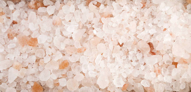 喜马拉雅粉红盐背景。 天然调味质地。