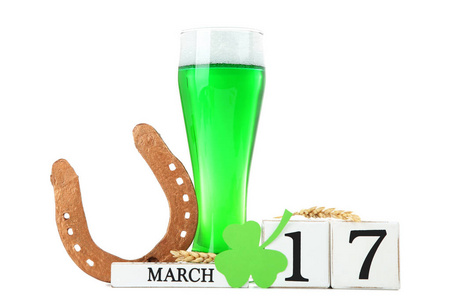 s Day. Green beer with wooden calendar, clover leaf and golden h