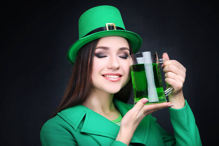 s Day. Beautiful woman wearing green hat with beer