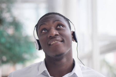  portrait of happy smiling Black African man enjoying digital mo