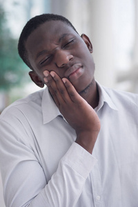  portrait of black man suffering from toothache pain, tooth deca