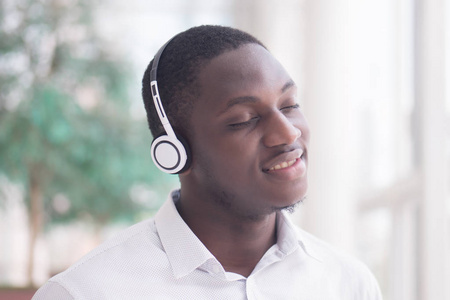  portrait of happy smiling Black African man enjoying digital mo