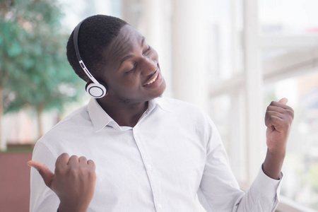  portrait of happy smiling Black African man enjoying digital mo