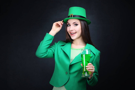 s Day. Beautiful woman wearing green hat with beer