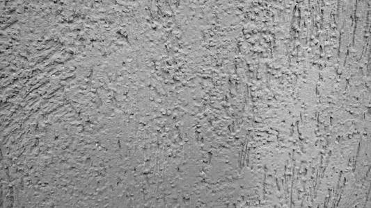 软焦中天然水泥质地的灰墙背景
