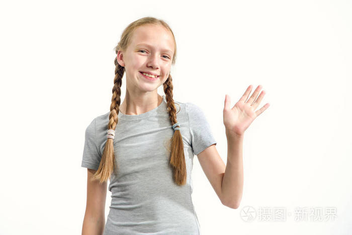 少女在灯光的背景下挥手打招呼.照片-正版商用图片192k6g-摄图新视界
