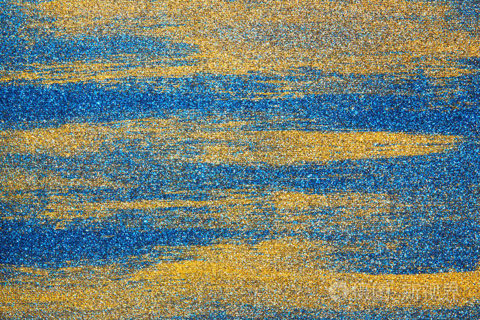 在画布上以蓝色和金色为背景的混合颜色的抽象画