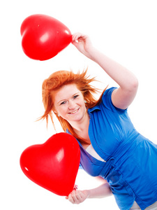 女孩握着两个情人节气球心