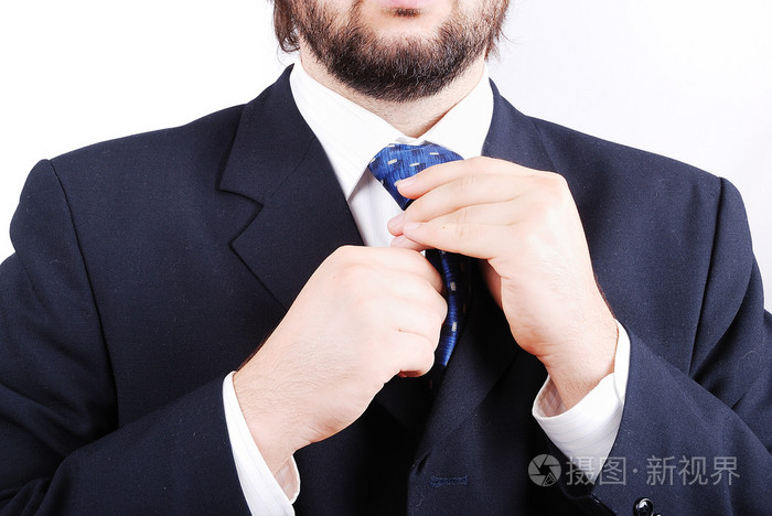 在现代的西装与领带的年轻男模特照片-正版商用图片19bg5z-摄图新视界