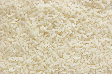 白色长水稻背景，未经煮熟的原料谷物，宏特写