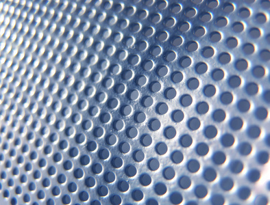 淡蓝科技背景淡蓝色的金属孔照片