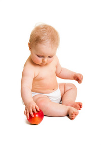 可爱的婴儿女孩与孤立在白色的苹果