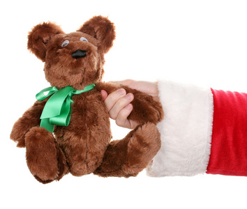 圣诞老人手上白色隔离的玩具熊