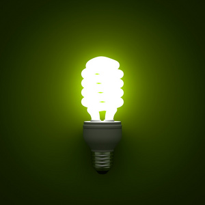 节能荧光灯管发光在绿色背景
