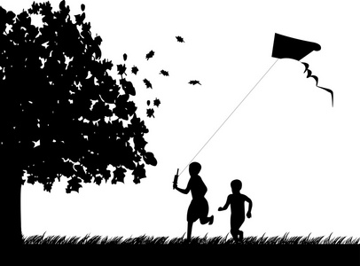 运行与在秋天或秋天在公园放风筝的男孩的身影