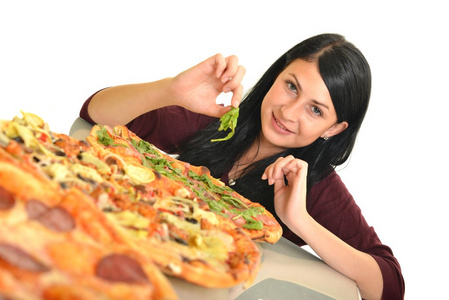 年轻女人吃了一块披萨白色背景