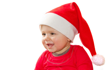 在圣诞老人帽子甜美微笑着蹒跚学步