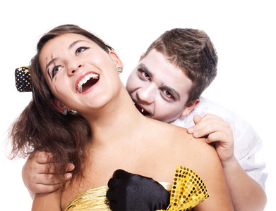 年轻的吸血鬼男孩准备咬在此令人不寒而栗的图像照片