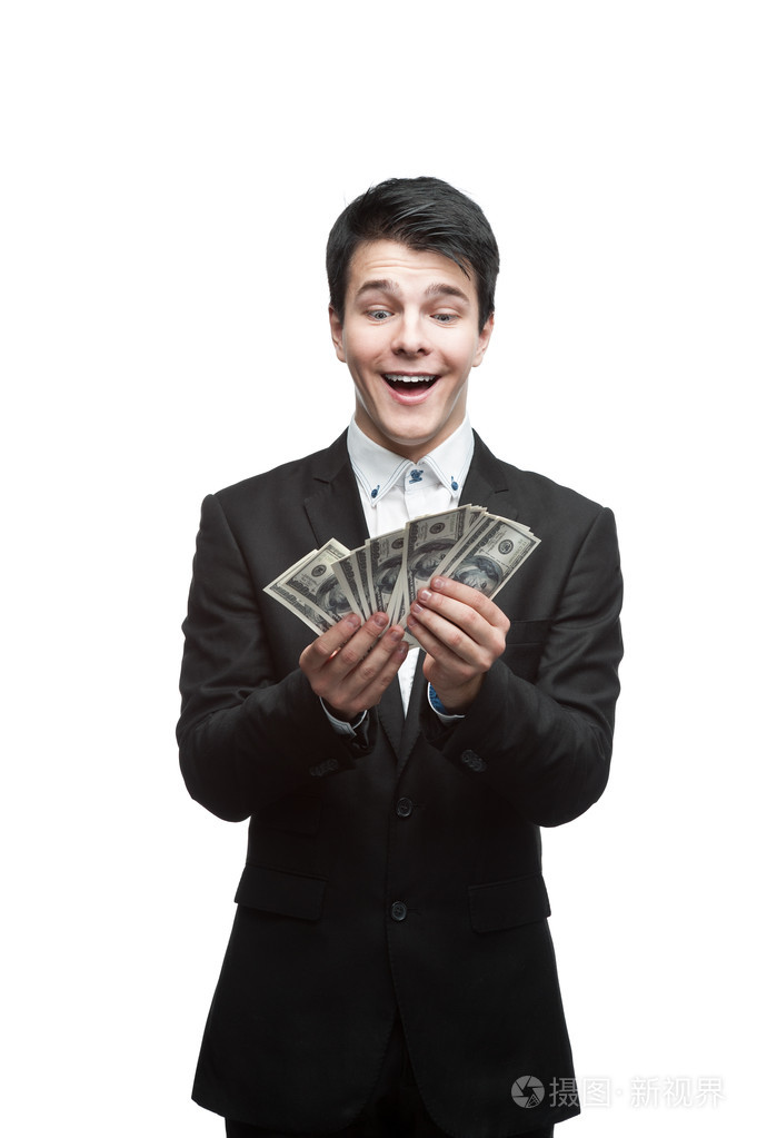 搞笑的年轻商业男人拿钱