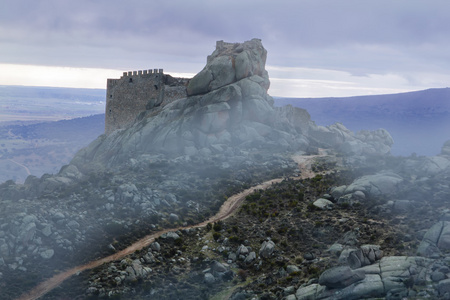 Ancient castle in the mist. vila. Spain.