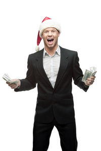 尖叫着圣诞老人帽子持有货币的商人