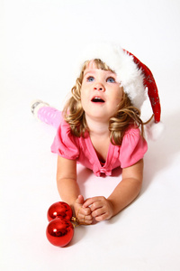 在圣诞老人被隔绝在白色背景上的一顶帽子的小宝贝