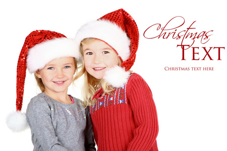 两个孩子穿上圣诞老人的帽子