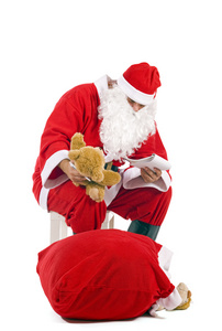 圣诞圣诞老人检查他列表 孤立在白色
