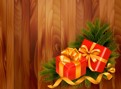 假日复古背景与圣诞树枝和礼物 b