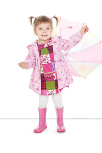 在与白上伞粉红色靴子搞笑小女孩