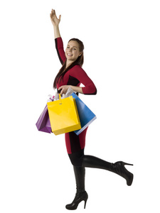 快乐年轻女人携带纸包