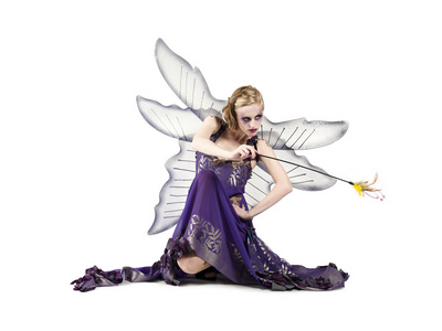 挥舞棒仙女挥舞着她的魔杖照片