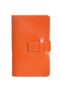 橙色皮革笔记本上白色隔离