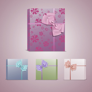 一套彩色礼品盒，配有蝴蝶结和丝带