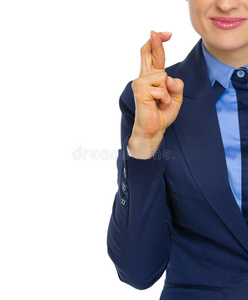 商业女性的特写与交叉手指